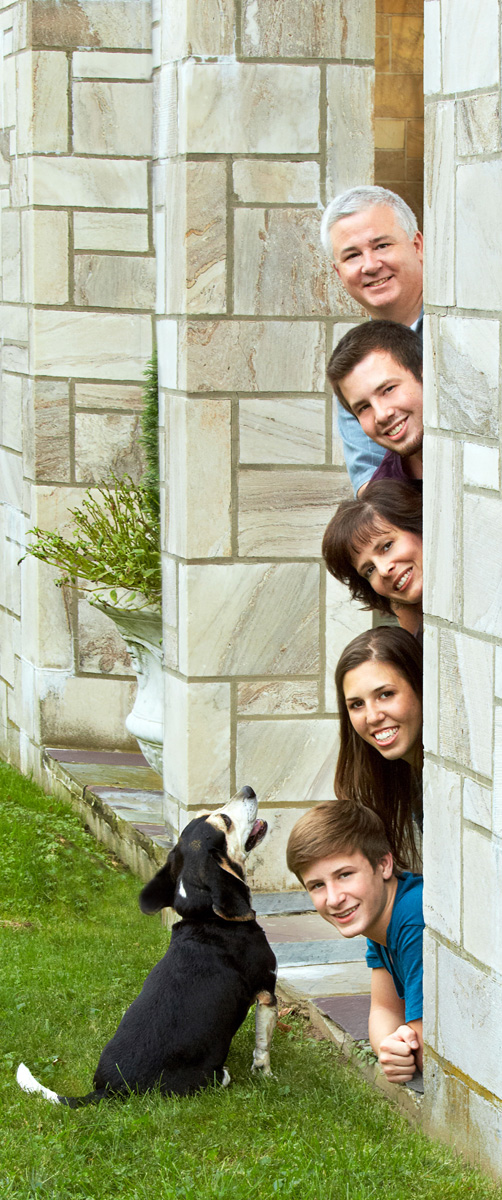 Family group outside with dog